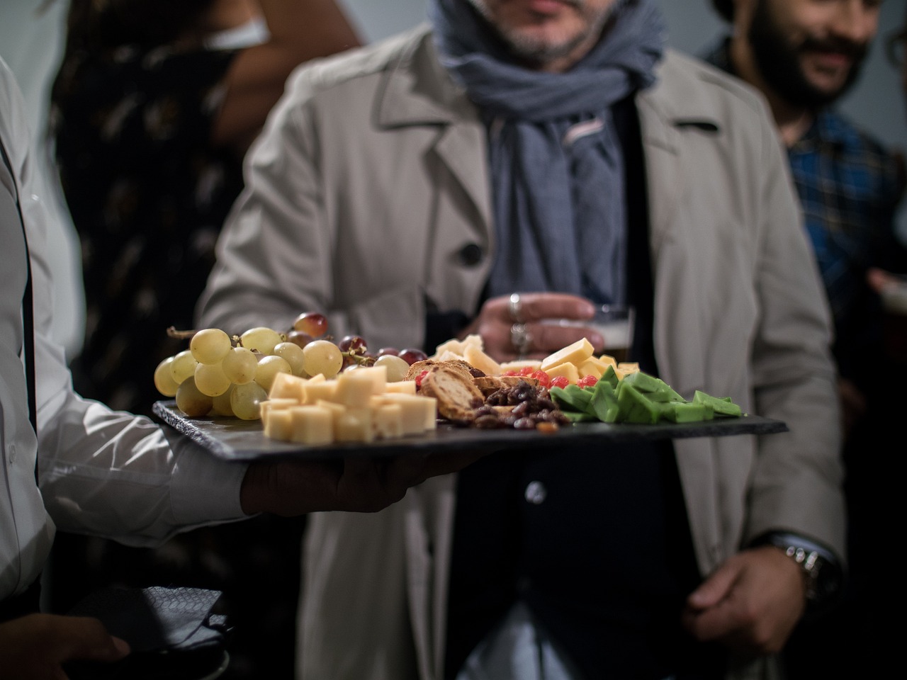 Waiter holding sliders