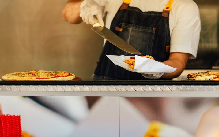 Pizza being served