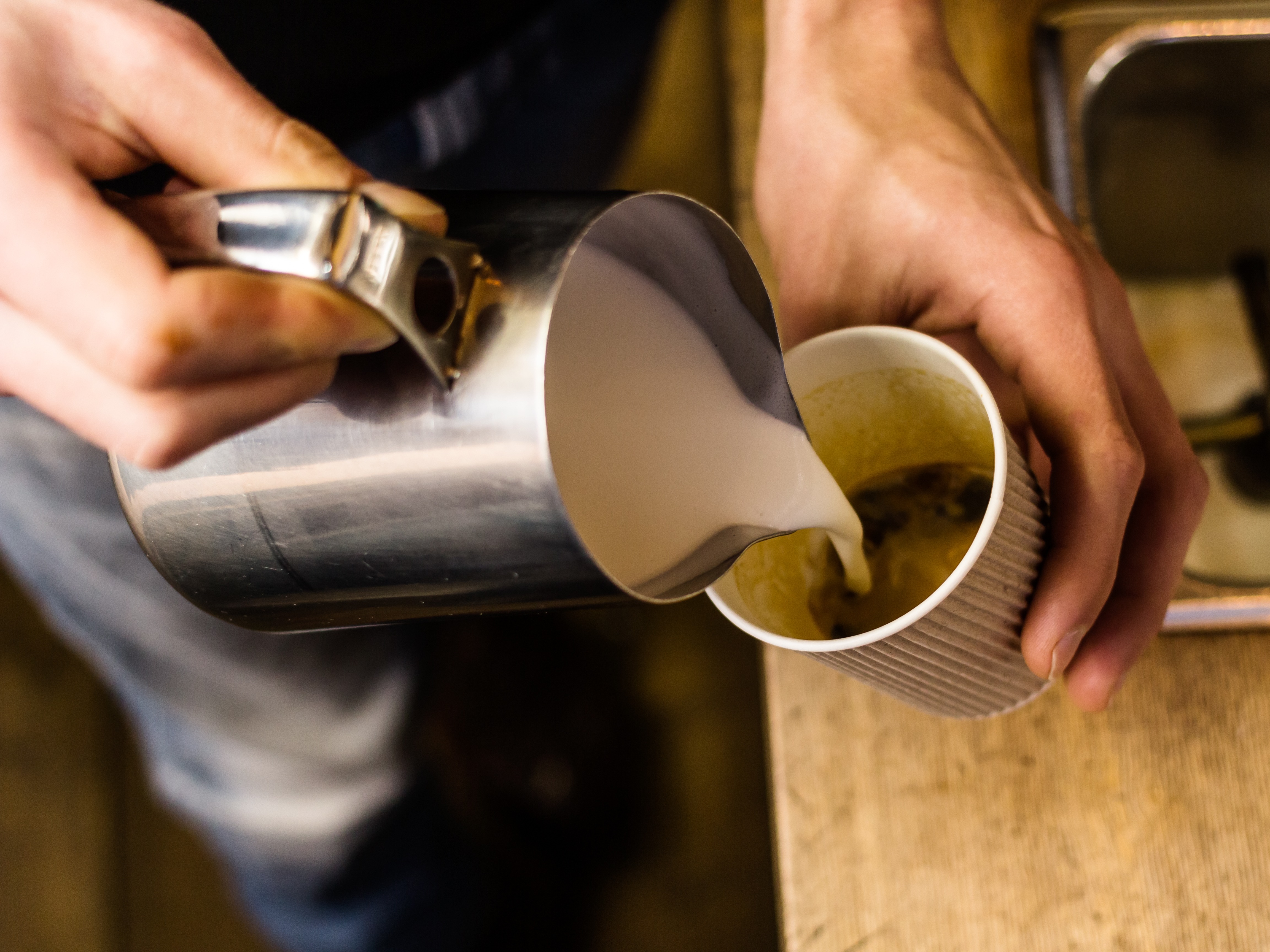 Takeaway coffee Takeaway coffee being poured