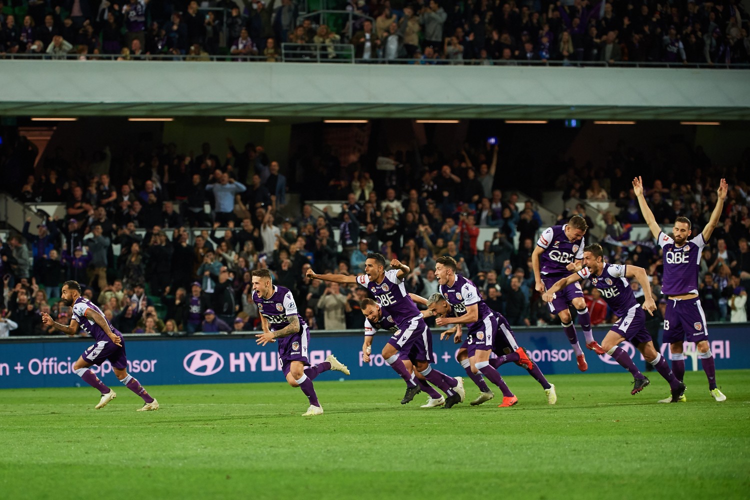 Perth Glory team celebrate penalty win
